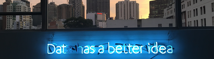 Skyline with blue neon sign